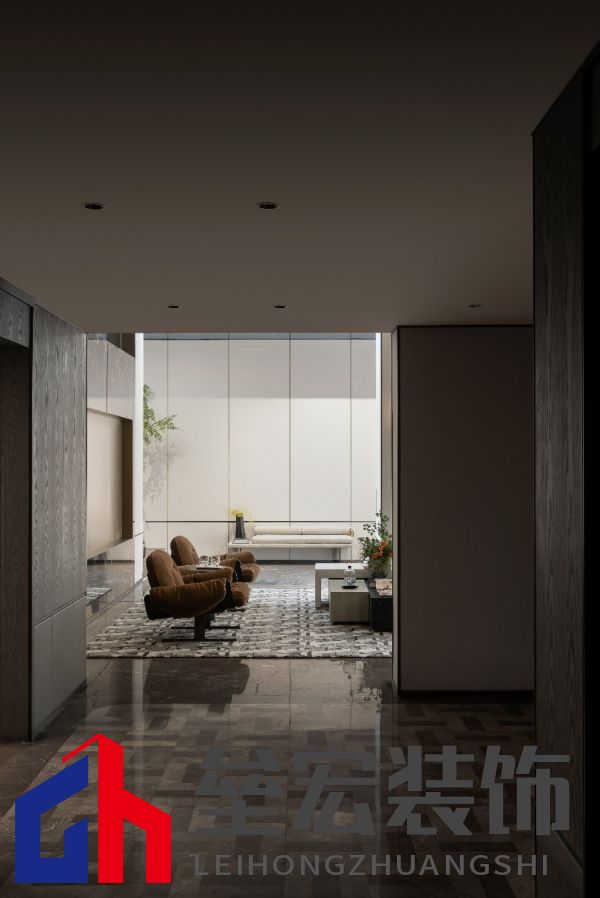 A room with a couch and a coffee table Description automatically generated